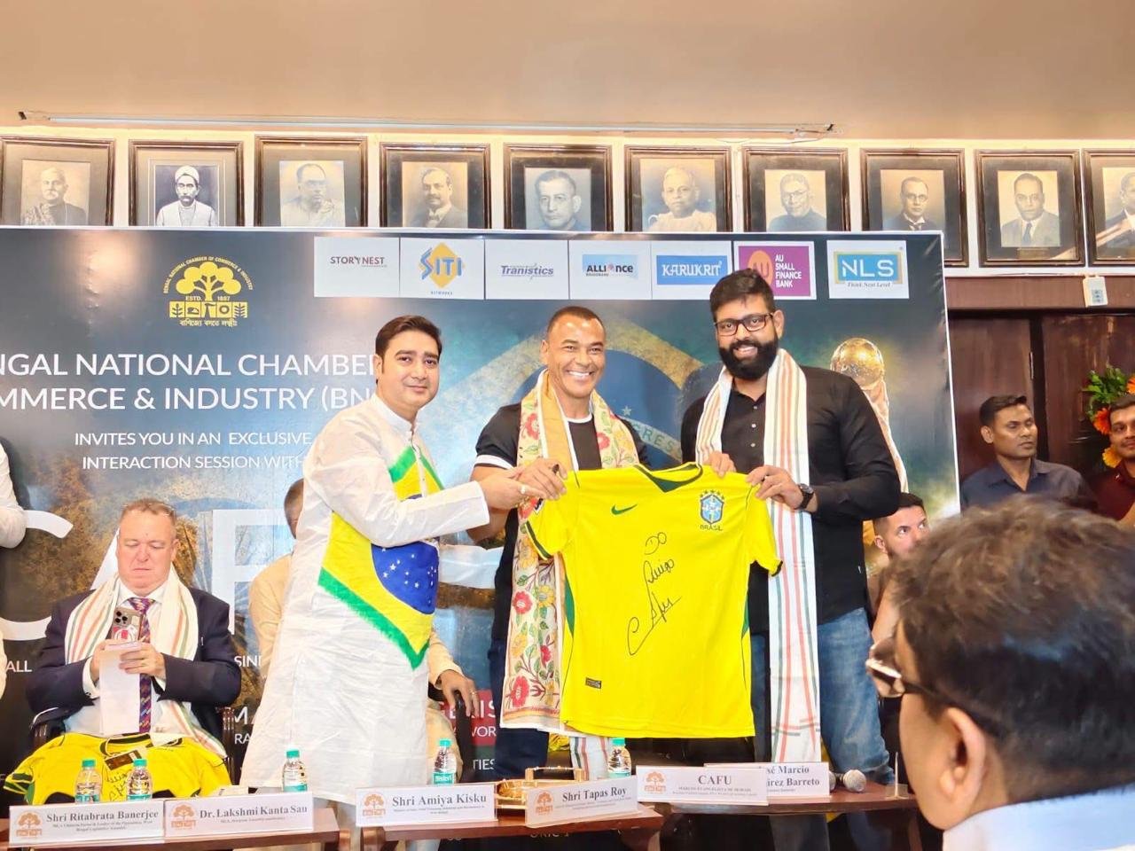 Exchanging jerseys with Brazilian football legend Cafu at a Bengal National Chamber of Commerce & Industry interaction session.