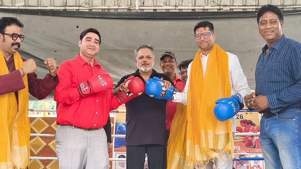 Gloving up ringside at a state boxing championship, in his role with West Bengal's boxing associations.