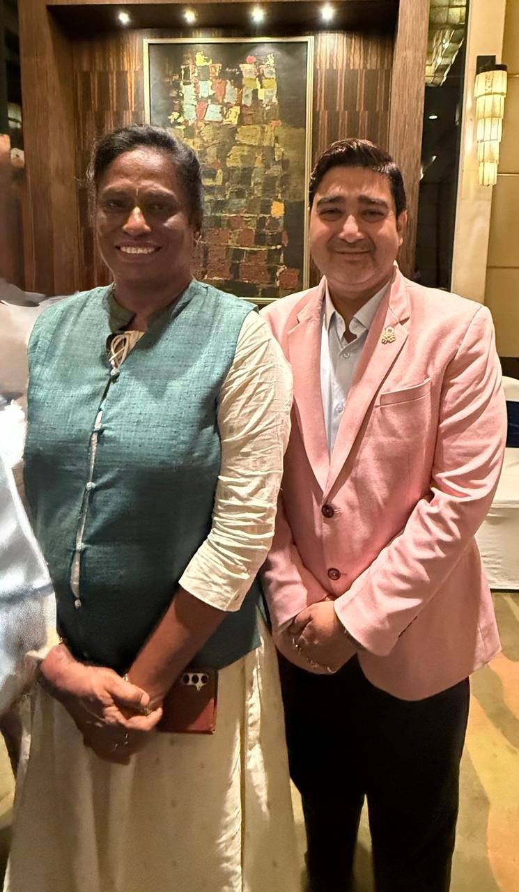 At an evening reception with a fellow guest of honour.